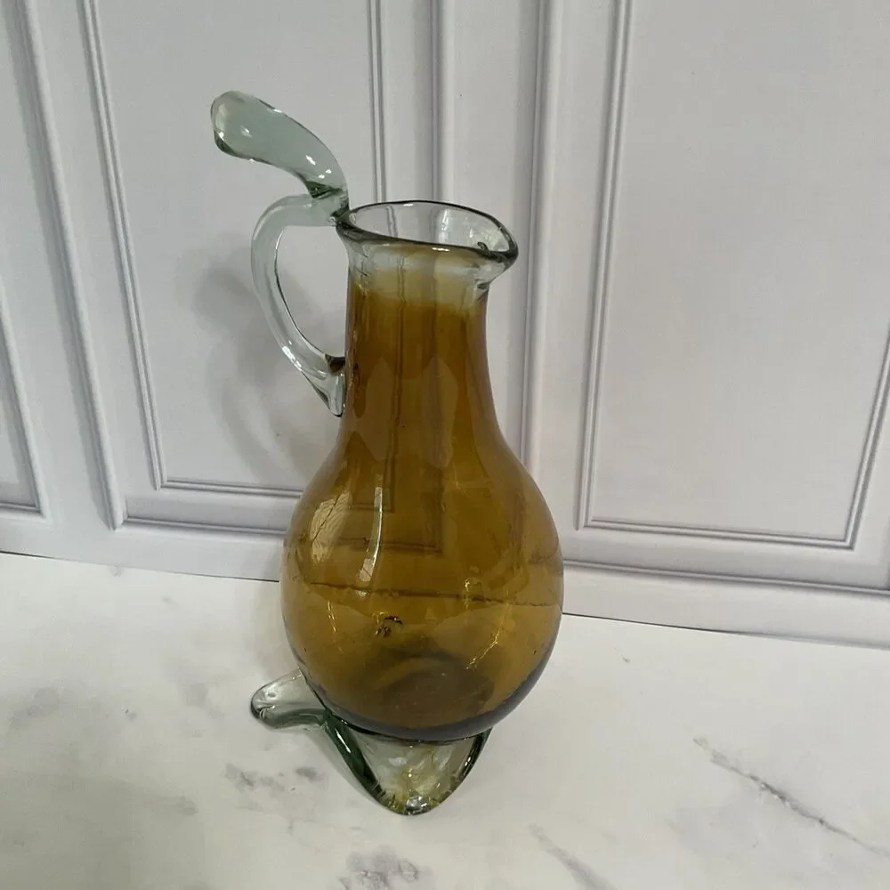 Hand Blown Glass Amber Pitcher with attached Clear Handle 10.5”Tall Clear Base